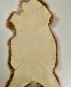 A piece of leather with fur on it.