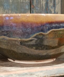 A bowl with a brown and blue design on it.