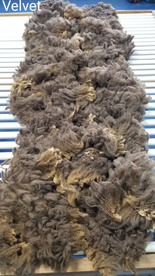 A pile of wool on top of a metal surface.