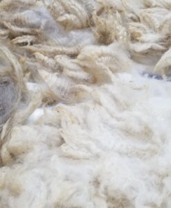 A pile of white wool in the middle of a room.